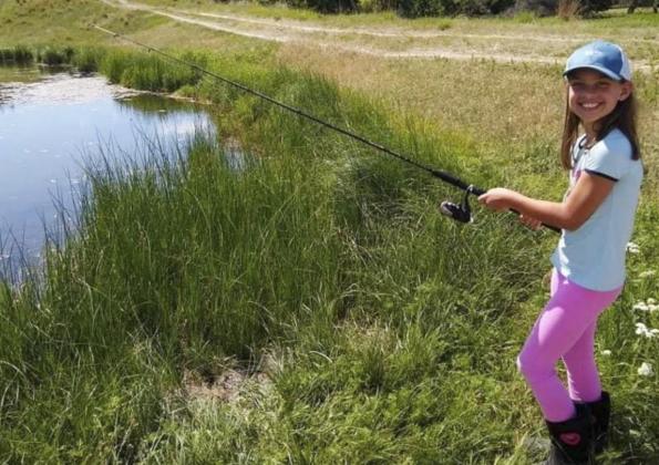 8-year-old Yasmine Alarcon enjoying a nice day out fishing.