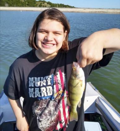 Mia Flores-Green with her catch at Merritt this summer.