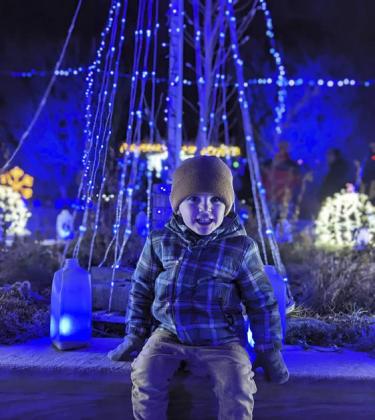 Graham Bester, son of Kayla and Ian Bester of Janesville, Wisconsin, and grandson of Don and Vicky Earl of Mullen enjoying the lights at the Rotary Botanical Gardens in Janesville.