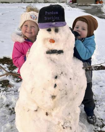 Violet and Aiden Stichka with the first Frosty The Snowman of the season.