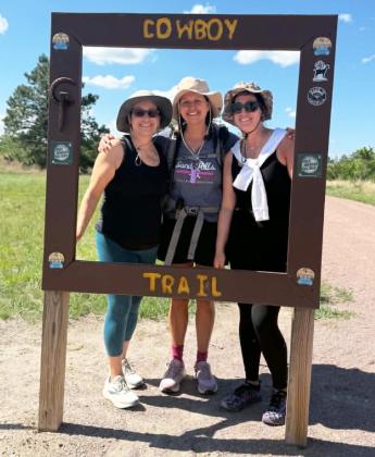 Jenny (center) with her sisters Jayme and Vicky at the end of their Cowboy Trail walk near the Valentine bridge. courtesy photo