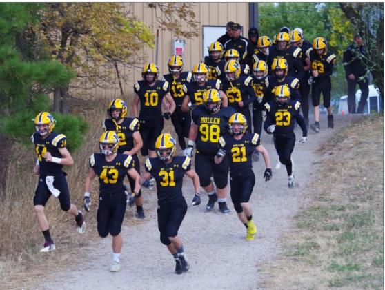 Like so many Broncos before them, the football team runs down the hill to their home field before last week’s game. Barb McIntosh