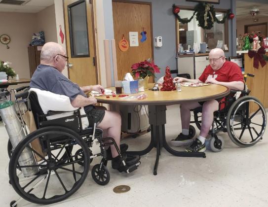 Stan Boyer (left) and Bob Osterman playing Bingo.