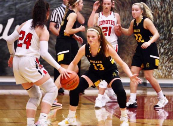 Kylie Licking on defense at Anselmo-Merna last Friday. Also pictured for the Broncos are Samantha Moore and Taylor Svoboda. Sue Licking