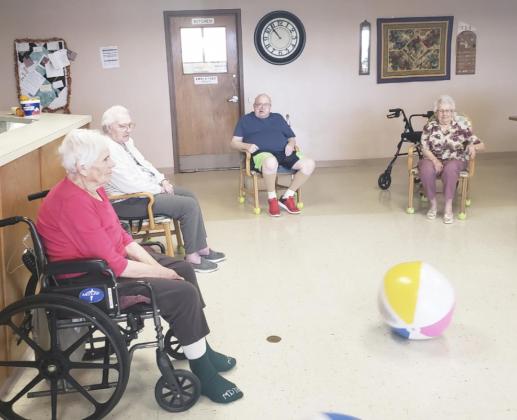 L-r: Marlene Dykes, Minnie Mary Hamilton, Bob Osterman and Nadene Andersen playing kickball with Gini Corbin.