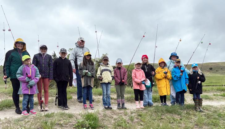 Fishing at Girl Scout Day Camp were, l-r: Maci Walz, Anna Hessin, Ava Walz, Ella Walz, Pastor Bill Williams, Mia Roman, Keira Kearns, Anna Ridenour, Tatum Deibler, Sadie Hoyt, Pastor Shanon Williams, Danielle Peterson, Daryl Deibler. Sooky Marks