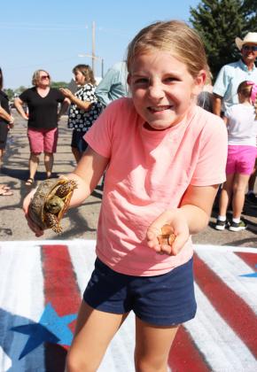 Eve Ericksen with her turtle who won the overall race. Gerri Peterson