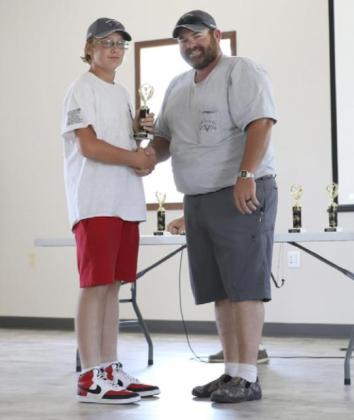 Daniel Wright accepts his trophy for 21 &amp;amp; Under from Hooker Motor Club’s Tanner Crisp.