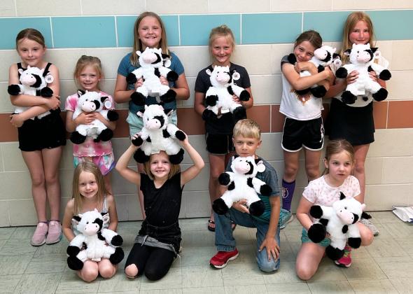 Julie Pfeiffer The Summer Reading Program, “Adventure Begins at Your Library” was held at the Hooker County Library on June 6. Participants are pictured with the cows they made during the morning and got to take home with them, back l-r: Sadie Hoyt, Brystol Call, Ella Walz, Danielle Peterson, Keira Kearns, Elle Gracey. Front: Aurora Polt, Ryann Walz, Killian Kearns, Eve Ericksen.