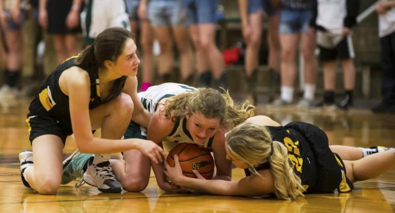 Allie Boyer (left) and Taylor Svoboda fight for a lose ball against Sandhills/Thedford last Thursday.