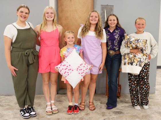 Public Fashion Show participants, l-r: Maci Walz, Ava Walz, Ryann Walz, Ella Walz, Audrabell Werth, Danielle Peterson. Gerri Peterson