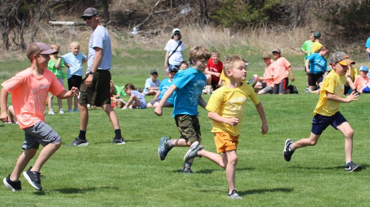 1st grade boys competing in the 25 yard dash, l-r: Kayden Evans, Merick Lattin, Jaxson Barnes, Tate Phillips.