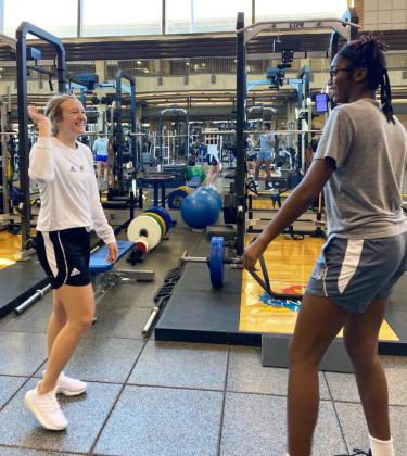 Ally Ginkens working with a tennis athlete at the University of Kansas. courtesy photo