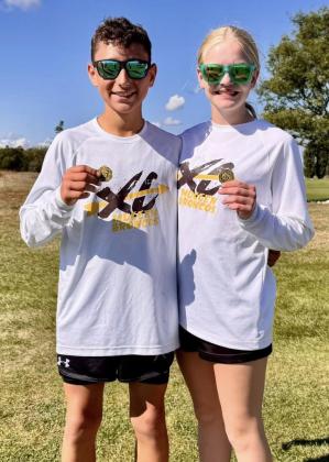 MNAC Junior High individual champions Gunner Brown and Ava Walz.