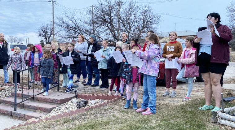 Girl Scouts go Christmas caroling