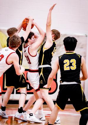 Brandon Hardin (left) and Jackson Vinton trap a Brady player. Carolee Brown Photography