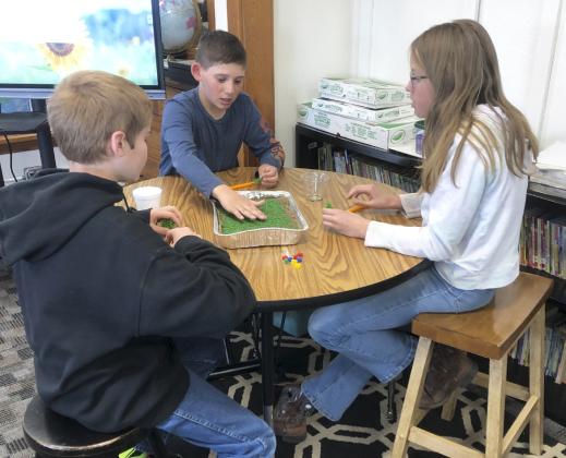 5th graders, l-r, Justin Kraus, Colin Connealy and Chloe Wiese.