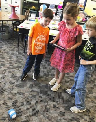Second graders control robots