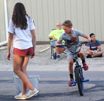 Eli Barnes competing in the sponge drop at the Bicycle Rodeo. Gerri Peterson