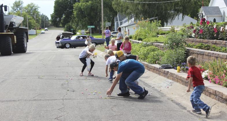 Kids gather candy as fast as they can during the parade.