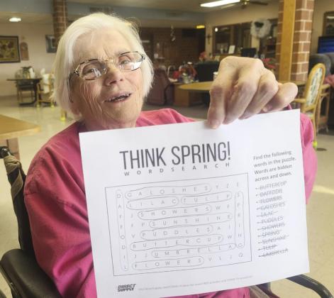 Marlene Dykes with her finished word find puzzle.