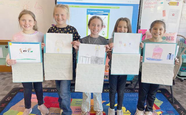 The 2nd grade students recently used the writing process to plan, draft, edit and publish a personal narrative. Pictured l-r: Aislynn Connealy, Danielle Peterson, Dailie Dent, Ellie Licking, Abigail Gonzalez. Emily Brown