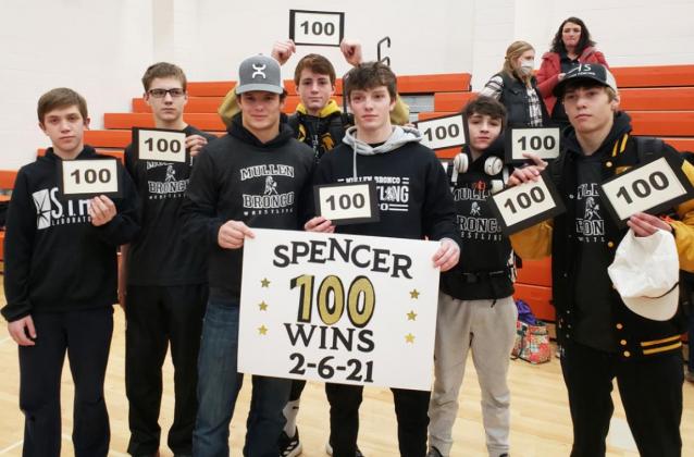 Spencer DeNaeyer (third from left) celebrates his 100th career win with his teammates last Saturday. courtesy photo
