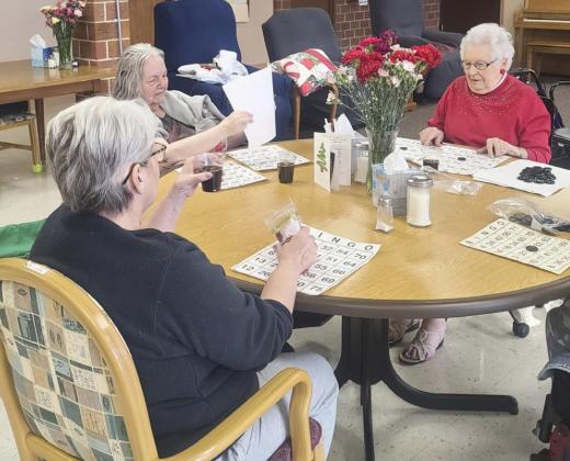 Lois Hardy, Ann Connell and Nadene Andersen getting ready for Bingo.