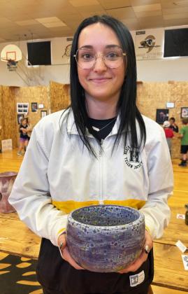 MHS senior Fayth Brown with her favorite pottery piece she had entered in the show. Gerri Peterson