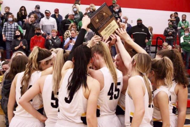 The Lady Broncos with the District Champion plaque last Friday. Sue Licking