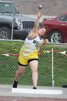 Mia Flores-Green competing in the shot put at Districts. Jill Coble