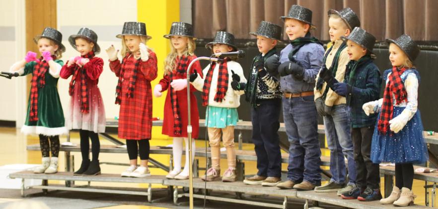 The Mullen Elementary Christ-mas Concert was held last Tuesday, Dec. 3, directed by Mrs. Mary Jo Walker, with each grade singing three songs. Top photo: Grades K-5 sang “We Wish You A Merry Christmas” for the finale of the concert. Bottom photo: Kindergarteners at their first Christmas concert, l-r: Ryann Walz, Ryhme Pettit, Harper Myers, Brystol Call, Addison Mundorf, Finnegan Connealy, Lane Brown, Cooper Peers, Austin Smith, Doris Boland. Gerri Peterson