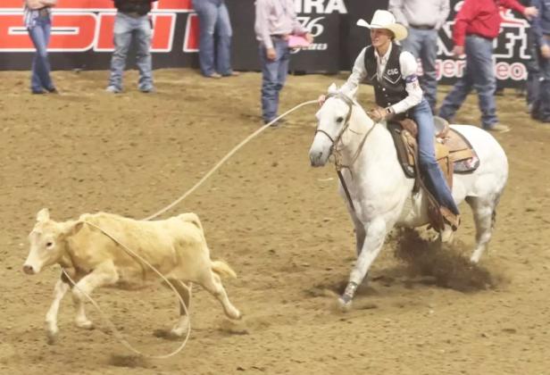While riding her gray gelding, Tom, Chadron State College senior Brooke McCully of Mullen roped her calf in 2.4 seconds to place third in the final go-round of breakaway roping at the College National Finals Rodeo in Casper, Wyoming, last Saturday night. Steph Miller