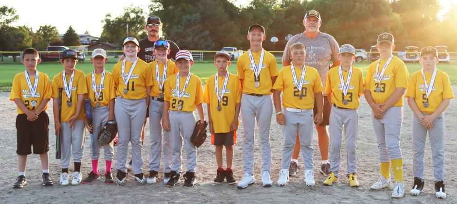 The Mullen youth baseball team finished their season as league runners-up last Thursday, June 26 in Mullen, losing in an exciting game against Arnold, 2-3. Pictured l-r: Marcus Lattin, Tuff Pettit, Eli Barnes, Jackson Newman, Coach Bo Pettit, Duke Miller, Cooper Phillips, Jaxyn Evans, Teal Peterson, Carson Hegland, Coach Russ Monette, Kyler Marsh, Collin Donohoe, Zach Hicks. Gerri Peterson