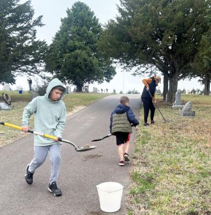The Phillips family was among the volunteers digging cacti.