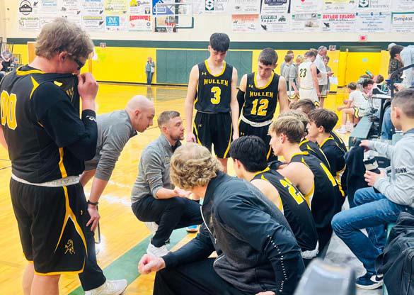 L-r: Coaches Dan Young, Darrick Hanks and Brad Wright talk to their team last week at Hay Springs. Carolee Brown