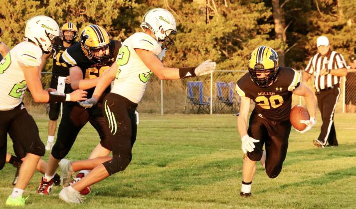 Senior Justin French carries the ball last Friday night. Carolee Brown