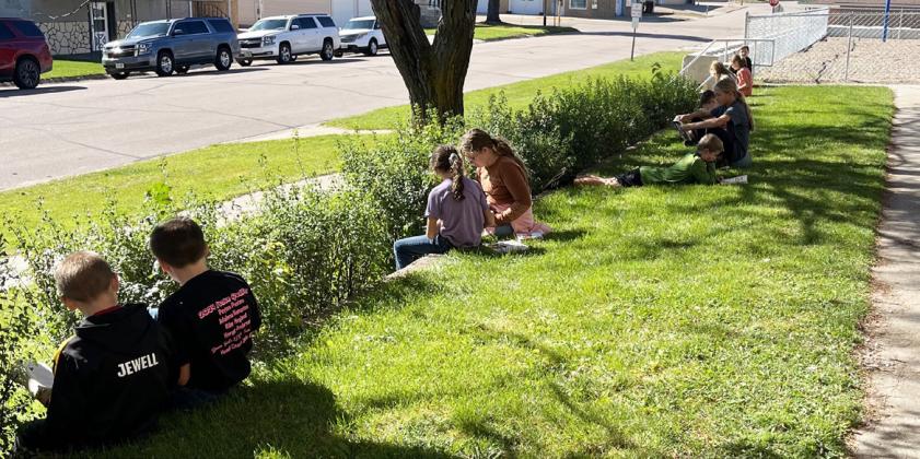 The Mullen fifth graders took advantage of the nice weather last Friday and spent their “Free Read Friday” enjoying a book in the sunshine. Emily Stichka