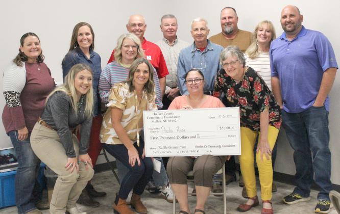 Paula Rice is pictured with the Hooker County Community Foundation Board, back l-r: Stacy Kraye, Gerri Peterson, Barb Svoboda, Ron Boyer, Kirk Jacobs, Scott Jones, Larry Ridenour, Yvonne Andrews, Casey Phillips. Front: Addie Lovitt, Kara Connealy, Paula and Mary Lou Harding. HCCF board member not pictured: George Vinton. Lyn Crisp