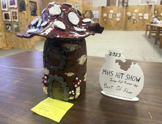 Breckyn Burney’s Mushroom House that won Junior High Runner-up Best of Show. Left: Whitney Jennings with her favorite piece.