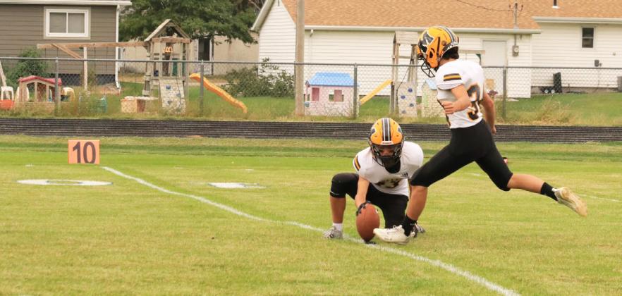 Ben Werner holds the ball for a Nicholas Gonzalez PAT kick. Carolee Brown
