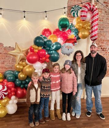 The Seeley family is pictured in front of one of their creations at Christmas Parade of Lights last year in Alliance, l-r: Tate, Brogan, Madelyn, Clara, Meg and Jake. courtesy photos