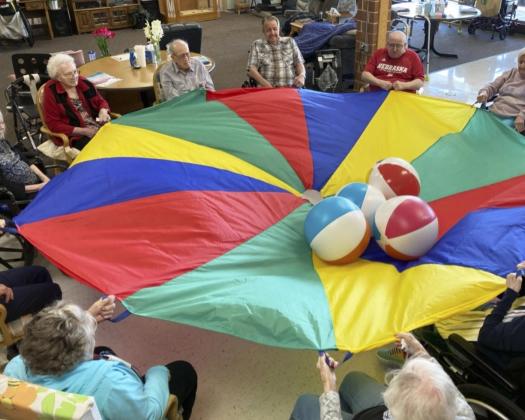 The residents enjoy the parachute!