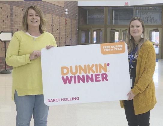 Darci Holling (right) was presented with her award on Monday.