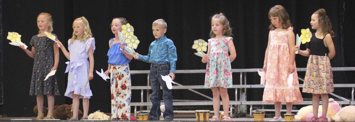Kindergarteners singing Spring Again, l-r: Danielle Peterson, Fallon Lee, Dailie Dent, Trent Cox, Eve Ericksen, Aislynn Connealy, Ellie Licking.