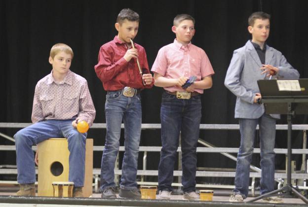5th grade percussion l-r: Justin Kraus, Gunner Brown, Colin Connealy and Brandt Mundorf play Skeleton Dance.