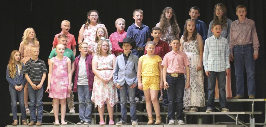 The 4th/5th graders sing Together by For King &amp; Country. Pictured back row, l-r: Teal Peterson, Pandora Gray, Trenton Billingsley, Hayden Deibler, Ava Kvanvig, Cort Cox, Yasmine Alarcon, Justin Kraus. Middle: Hadley Marsh, Carson Hegland, Chloe Wiese, Gunner Brown, Langston Pohlmeier-Fajardo, Bronx Burney. Front: Olivia Cox, Weston Ourada, Ava Walz, Cooper Cash, Jocelyn Oliveira, Brandt Mundorf, Bella Coetzee, Colin Connealy.