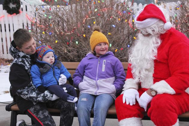 Hayden, Mason and Tatum Deibler. Mason was woke up from a nap for his first visit to Santa, but then didn’t even seem to notice Santa and just had eyes for mom!