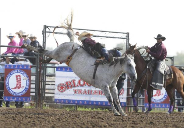 Spencer DeNaeyer competing in bareback riding at Nationals.