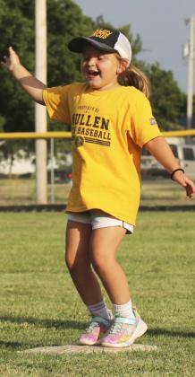 Charley Zimmerman does a happy dance on first base after getting a hit for the first time in a coach pitch game.